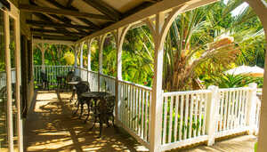 outdoor seating on the veranda at the cafe building at abbotsbury subtropical gardens outdoor seating on the veranda at the cafe building at abbotsbury subtropical gardens